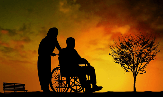 車椅子利用者と介護者の影